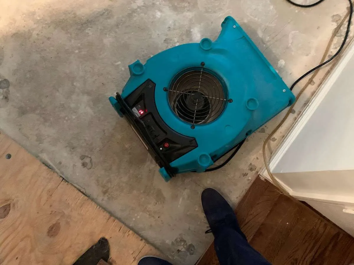Air mover drying subfloor during Commercial Water Damage Restoration in Agawam Town