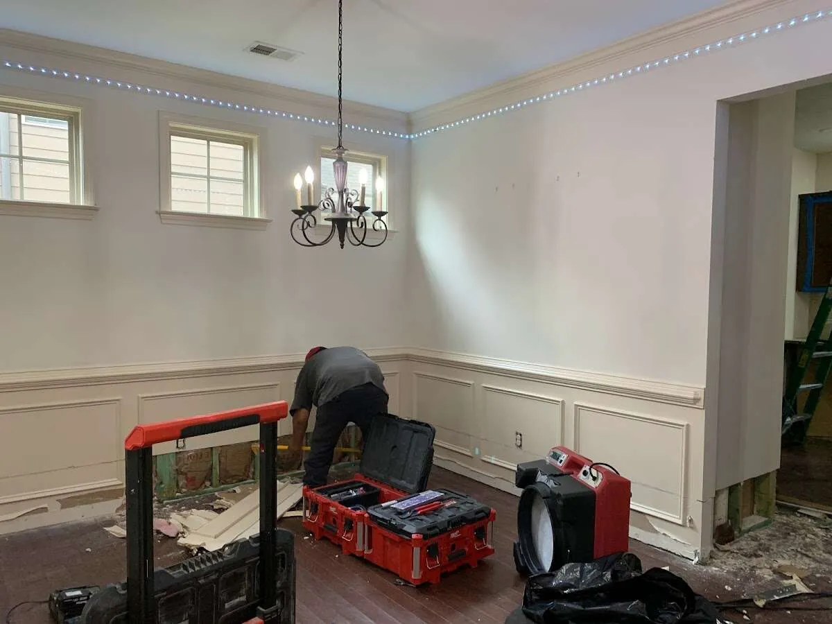 Restoration technician with professional equipment in Agawam Town